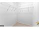 Empty walk-in closet with white walls, metal shelving, and carpeted floors at 125 Lake Park Dr, Sharpsburg, GA 30277
