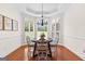 Bright dining area with large windows and elegant chandelier at 125 Lake Park Dr, Sharpsburg, GA 30277