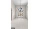 Elegant dining room with a decorative chandelier and wainscoting, illuminated by a large arched window at 125 Lake Park Dr, Sharpsburg, GA 30277