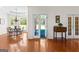 Spacious dining room features hardwood floors, elegant chandelier, and backyard views at 125 Lake Park Dr, Sharpsburg, GA 30277
