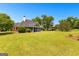 Charming home featuring a screened porch and expansive backyard, perfect for outdoor living at 125 Lake Park Dr, Sharpsburg, GA 30277