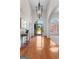 Bright and airy foyer featuring hardwood floors, high ceilings, and an elegant chandelier at 125 Lake Park Dr, Sharpsburg, GA 30277