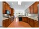 Well-equipped kitchen with wood cabinets and adjoining eat-in area at 125 Lake Park Dr, Sharpsburg, GA 30277