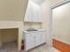 Mud room with built in storage and large utility sink at 125 Lake Park Dr, Sharpsburg, GA 30277