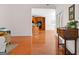 Spacious room with hardwood floors and view of the kitchen area at 125 Lake Park Dr, Sharpsburg, GA 30277
