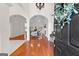 Open-concept living room with hardwood floors, ample natural light, and a cozy fireplace at 125 Lake Park Dr, Sharpsburg, GA 30277