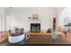 Inviting living room with fireplace, comfortable seating, and stylish decor at 125 Lake Park Dr, Sharpsburg, GA 30277