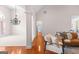 Open-concept living room with hardwood floors, bright light, and modern furnishings at 125 Lake Park Dr, Sharpsburg, GA 30277