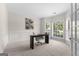 Bright home office with a large window, wainscoting, and a neutral color palette at 125 Lake Park Dr, Sharpsburg, GA 30277