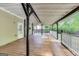 Spacious covered back deck featuring a ceiling fan and wooden flooring, perfect for outdoor relaxation at 365 Othello Dr, Hampton, GA 30228