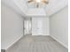 Bedroom featuring neutral carpet, trey ceilings, and an open doorway at 365 Othello Dr, Hampton, GA 30228