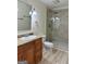 Bathroom featuring granite countertop vanity and tiled walk-in shower at 1503 Wingate Way # 1503, Sandy Springs, GA 30350