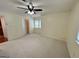 Spacious bedroom featuring ceiling fan, closet, and natural light at 1503 Wingate Way # 1503, Sandy Springs, GA 30350