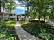 Charming condominium exterior with manicured landscaping and inviting walkway at 1503 Wingate Way # 1503, Sandy Springs, GA 30350