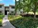 Charming condominium exterior with manicured landscaping and inviting walkway at 1503 Wingate Way # 1503, Sandy Springs, GA 30350