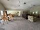 Spacious living room with kitchen, dining area, seating and multiple ceiling fans at 1503 Wingate Way # 1503, Sandy Springs, GA 30350