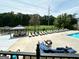 Relaxing pool area with lounge chairs and seating, perfect for summer days at 1503 Wingate Way # 1503, Sandy Springs, GA 30350