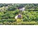 A sprawling property with a luxurious home, surrounded by lush trees, a lake, and manicured lawns at 4320 Blue Ridge Dr, Douglasville, GA 30135
