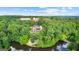 Aerial view of a home surrounded by dense woods, featuring a pool and tiered backyard at 4320 Blue Ridge Dr, Douglasville, GA 30135