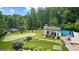 Expansive backyard with putting green, covered outdoor living space, and swimming pool at 4320 Blue Ridge Dr, Douglasville, GA 30135