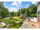 Backyard featuring putting green, stone landscaping, and covered outdoor living space at 4320 Blue Ridge Dr, Douglasville, GA 30135