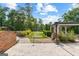 Lush backyard showcasing an artificial putting green and a charming gazebo nestled amidst landscaped greenery at 4320 Blue Ridge Dr, Douglasville, GA 30135