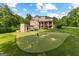 Expansive backyard featuring a large putting green and well-maintained lawn at 4320 Blue Ridge Dr, Douglasville, GA 30135