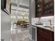 Convenient bar area with marble countertop and views to the comfortable and naturally lit living room area at 4320 Blue Ridge Dr, Douglasville, GA 30135
