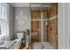 This bathroom showcases a tiled shower with a glass door and decorative accents at 4320 Blue Ridge Dr, Douglasville, GA 30135