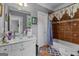 Charming bathroom featuring a glass bowl sink, granite countertop, and a decorative shower curtain at 4320 Blue Ridge Dr, Douglasville, GA 30135