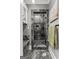 Beautiful shower encased in stylish tile with built in shelves and rain shower head and handheld fixture at 4320 Blue Ridge Dr, Douglasville, GA 30135