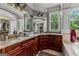 Bathroom vanity with granite countertops and dark wood cabinetry at 4320 Blue Ridge Dr, Douglasville, GA 30135