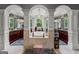 Luxurious bathroom featuring a central tub, dual vanities, and natural light from large windows at 4320 Blue Ridge Dr, Douglasville, GA 30135