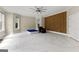 Large bonus room with a unique wood wall accent, ceiling fan, and plenty of natural light at 4320 Blue Ridge Dr, Douglasville, GA 30135