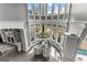 Aerial view of a dining area with vaulted ceiling, clerestory windows, chandelier, chairs and table at 4320 Blue Ridge Dr, Douglasville, GA 30135