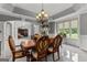 Formal dining room with decorative chandelier, arched entryways, and adjacent living area provides an easy flow at 4320 Blue Ridge Dr, Douglasville, GA 30135