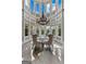 Bright dining area features a vaulted ceiling, natural lighting, and a stylish chandelier at 4320 Blue Ridge Dr, Douglasville, GA 30135