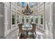 Bright dining area features a vaulted ceiling, natural lighting, and a stylish chandelier at 4320 Blue Ridge Dr, Douglasville, GA 30135