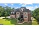 Two-story brick home features classic architecture, a manicured lawn, and mature trees at 4320 Blue Ridge Dr, Douglasville, GA 30135