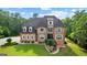 Beautiful two-story brick home with manicured lawn and lush landscaping at 4320 Blue Ridge Dr, Douglasville, GA 30135