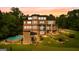 Beautiful view of home's exterior highlighting the pool, outdoor seating area, and manicured landscaping at 4320 Blue Ridge Dr, Douglasville, GA 30135
