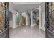 Grand foyer with soaring ceilings, arched entryways, and beautiful tile flooring showcases the home's elegance at 4320 Blue Ridge Dr, Douglasville, GA 30135
