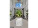 Elegant foyer with high ceilings, polished tile floors, and decorative wrought-iron double doors at 4320 Blue Ridge Dr, Douglasville, GA 30135