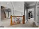 Open hallway boasting hardwood railing, arched ceilings, and elegant trimwork at 4320 Blue Ridge Dr, Douglasville, GA 30135