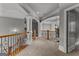 Hallway featuring hardwood railing, arched ceilings and decorative columns at 4320 Blue Ridge Dr, Douglasville, GA 30135