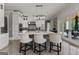 Spacious kitchen features an island with a marble countertop, pendant lighting, and stainless steel appliances at 4320 Blue Ridge Dr, Douglasville, GA 30135