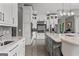 Bright kitchen with white cabinets, a gray island, stainless steel appliances, and light tile flooring at 4320 Blue Ridge Dr, Douglasville, GA 30135