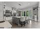 Bright kitchen with white cabinets, a gray island, stainless steel appliances, and access to the outdoors at 4320 Blue Ridge Dr, Douglasville, GA 30135