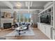 Cozy living room boasts a fireplace, built-in cabinets, and a large window for natural light at 4320 Blue Ridge Dr, Douglasville, GA 30135