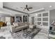 Bright and spacious living room with a modern leather sofa and stylish glass table on marble floors at 4320 Blue Ridge Dr, Douglasville, GA 30135